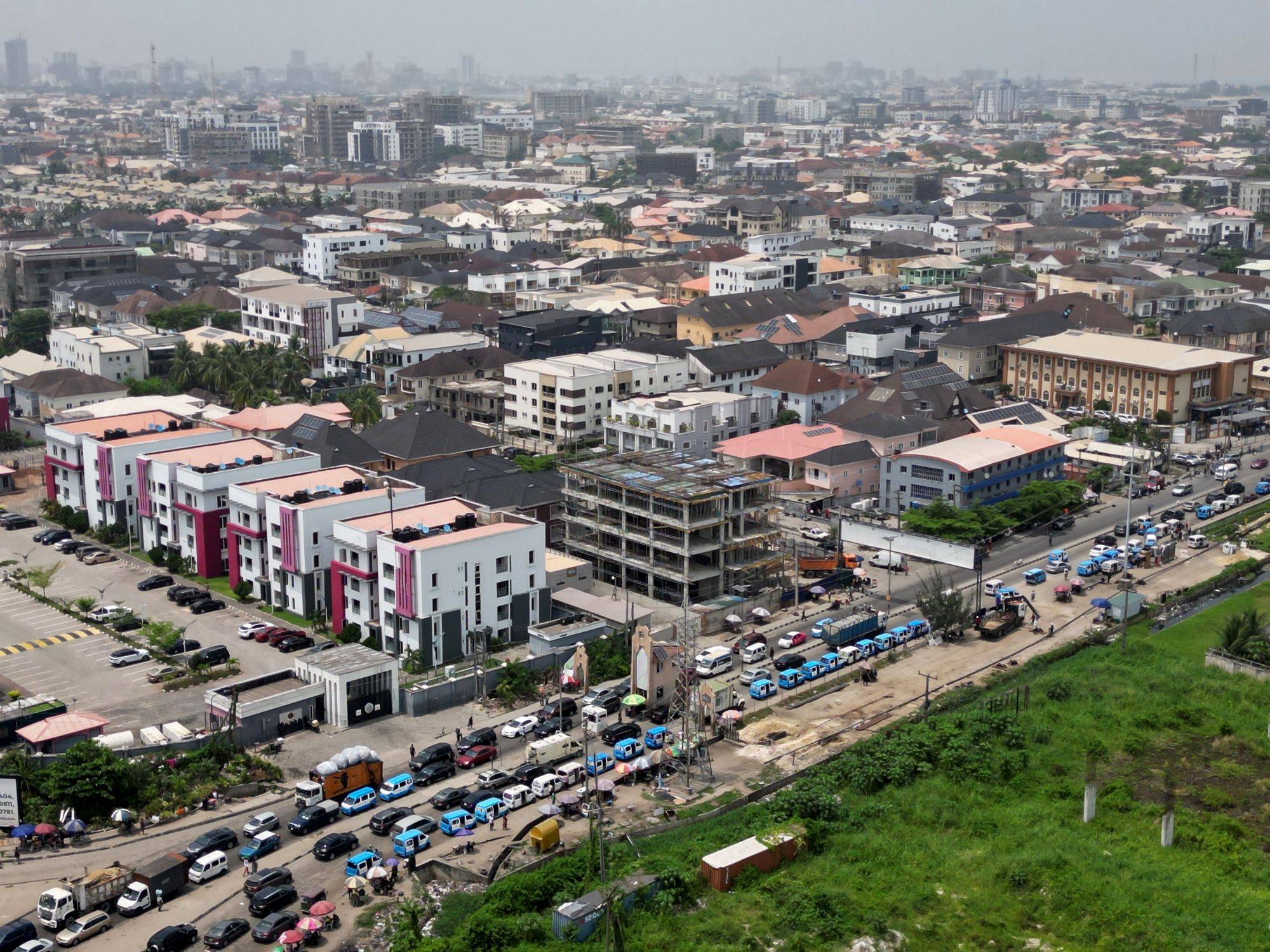 Lagos street scene with yellow buses
