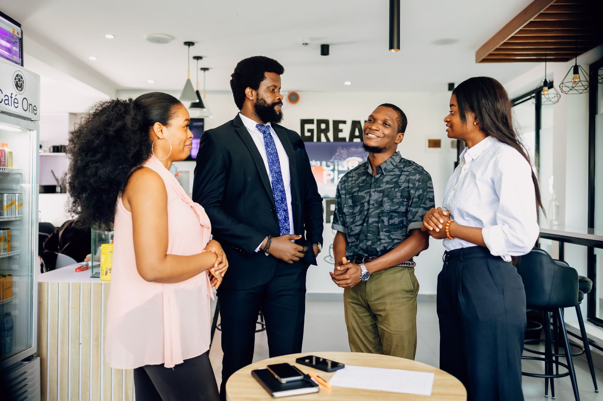 Professionals in conversation at an office