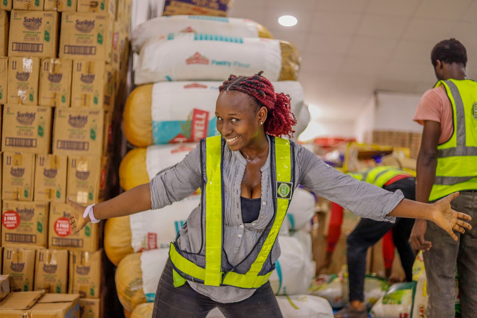 Warehouse worker handling stacked goods